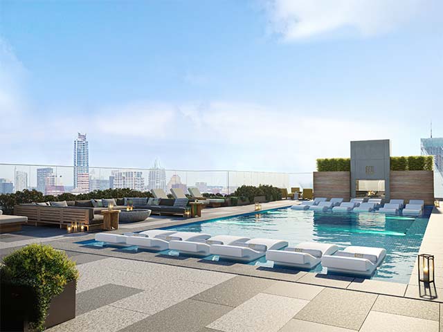 Rooftop infinity pool deck overlooking downtown Austin at sunset